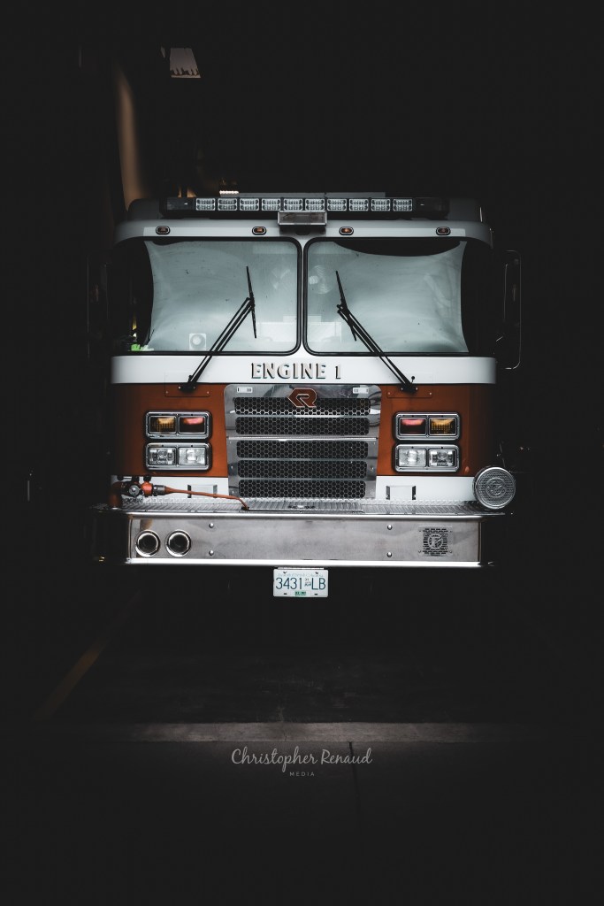 Firetruck parked at a station in Agassiz BC, captured by Chris R Media, emphasizing urban readiness and professional photography.